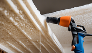 A complete guide to spray foam insulation: A cross-section of a cozy house with spray foam insulation being applied to the walls and roof, creating a warm and inviting atmosphere.
