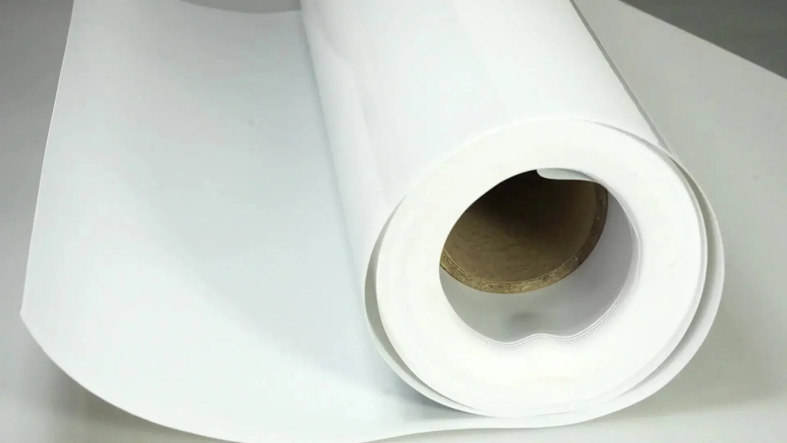 Roll of white Isogenopak insulation material for energy efficiency in ducts and pipes.