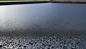 Textured surface with water droplets highlighting EPDM foam insulation properties.