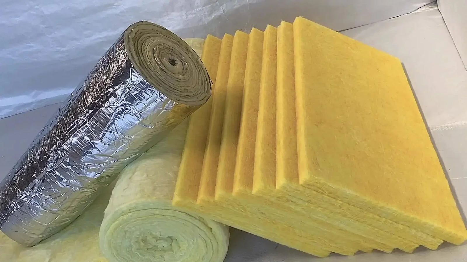 Insulation materials like foam rolls and yellow boards for fiberglass insulation thermal performance