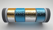 Cylindrical pipe insulation with gold and blue segments showing water droplet condensation