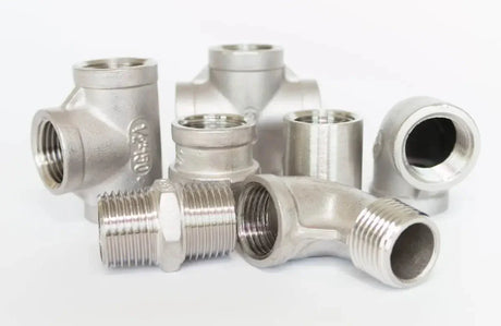 Assortment of metal pipe fittings and connectors for various piping systems to connect two sections